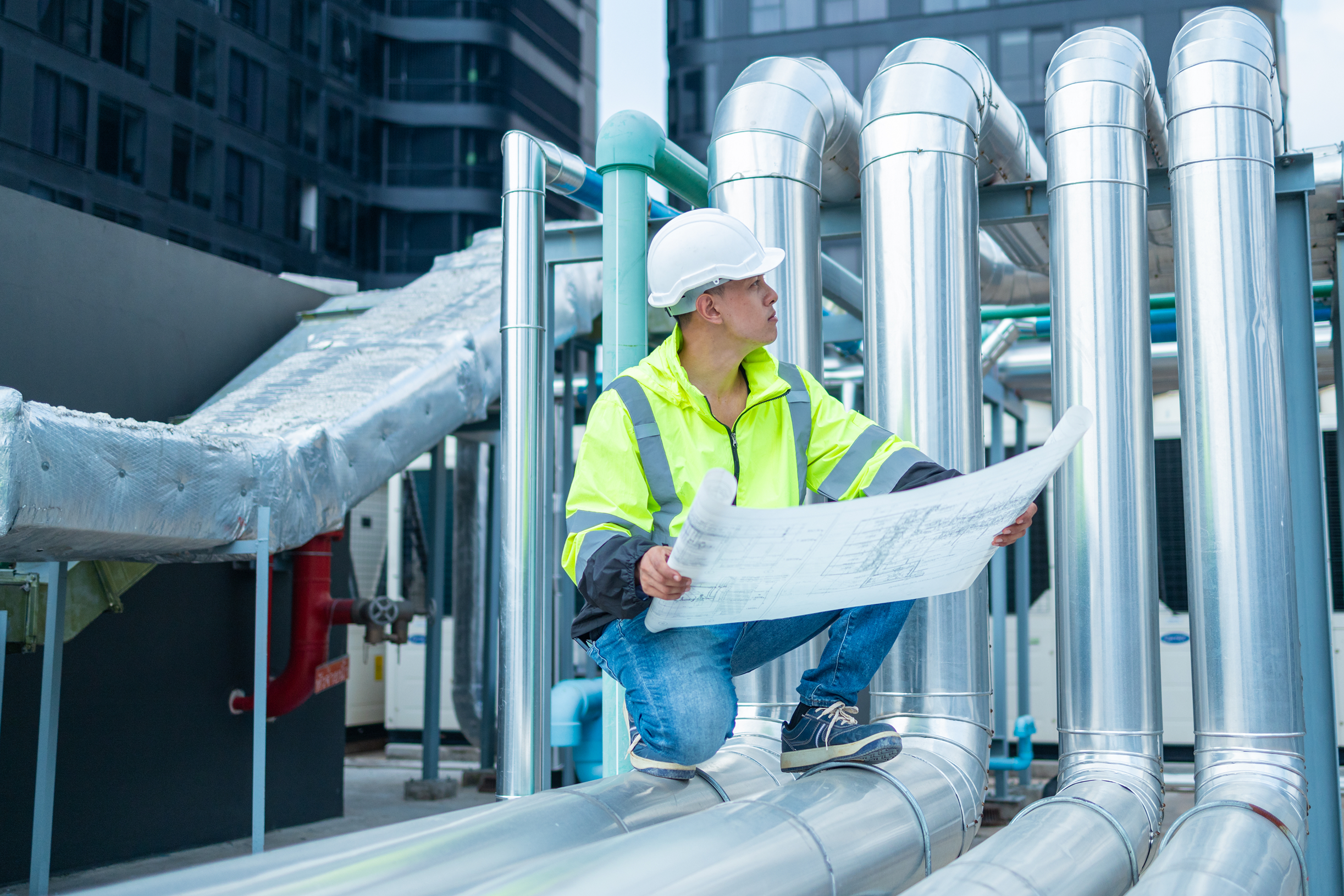 Engineer checking drawings on rooftop 2025 03 08 04 33 21 utc 1